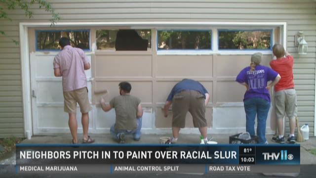 Little Rock neighborhood comes together to paint over racial slur on garage door